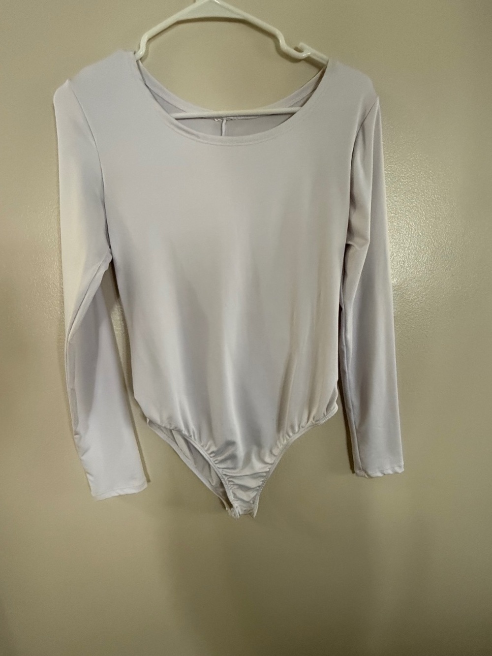Medium unbranded long sleeved white bodysuit